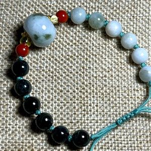 Burma Jade adjustable woven string bracelet, with gold plated accents.